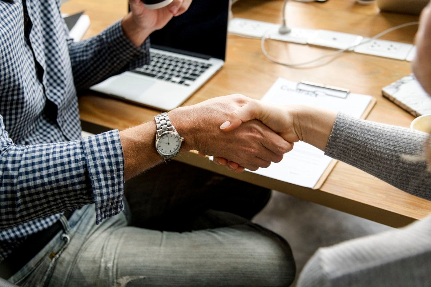 business people shaking hands in agreement
